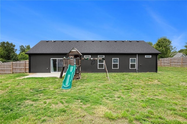 151 SE 225th Rd, Warrensburg, MO 64093 - back of house with a playground and roof with shingles