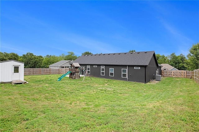 151 SE 225th Rd, Warrensburg, MO 64093 - back of property featuring a playground and central AC