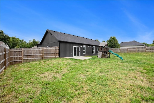 151 SE 225th Rd, Warrensburg, MO 64093 - rear view of property with a playground and a patio area