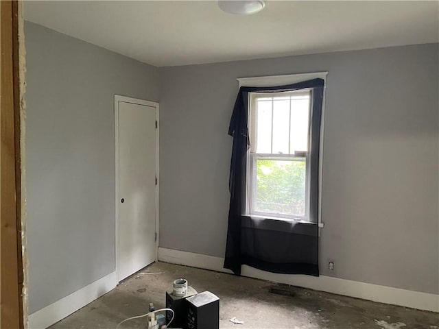 1226 10th Ave, Leavenworth, KS 66048 - empty room with plenty of natural light and baseboards