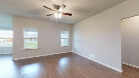 575 W Lanesfield St, Gardner, KS 66030 - empty room featuring a ceiling fan and dark wood finished floors