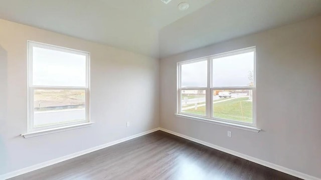 575 W Lanesfield St, Gardner, KS 66030 - empty room featuring dark wood-style flooring and vaulted ceiling