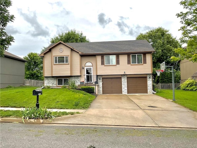 11601 N Manning Ave, Kansas City, MO 64157 - split foyer home featuring an attached garage, stone siding, and concrete driveway