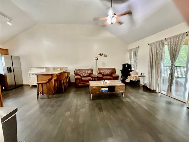 11601 N Manning Ave, Kansas City, MO 64157 - living room featuring vaulted ceiling, ceiling fan, and dark wood-style flooring