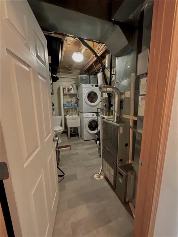 11601 N Manning Ave, Kansas City, MO 64157 - laundry room with stacked washing machine and dryer and tile patterned floors