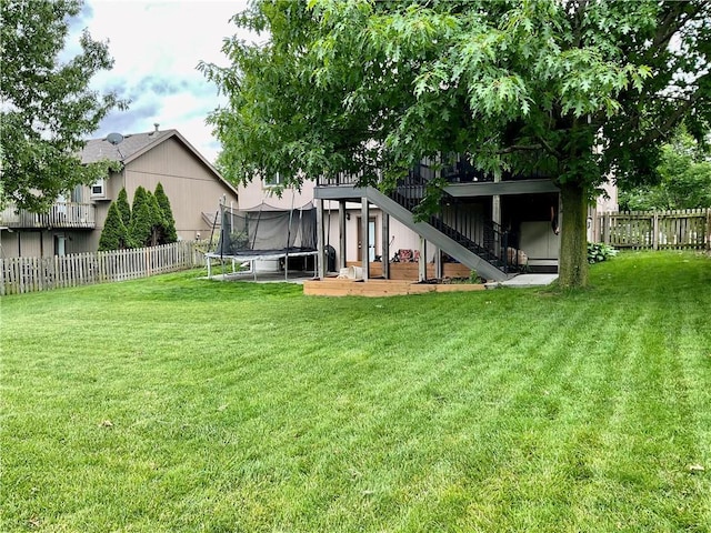 11601 N Manning Ave, Kansas City, MO 64157 - rear view of property featuring a trampoline and stairs