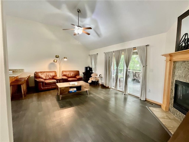 11601 N Manning Ave, Kansas City, MO 64157 - living area with a tile fireplace, a ceiling fan, wood finished floors, high vaulted ceiling, and baseboards