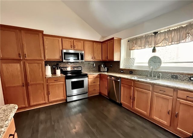 11601 N Manning Ave, Kansas City, MO 64157 - kitchen featuring appliances with stainless steel finishes, a sink, decorative backsplash, brown cabinets, and dark wood-style floors