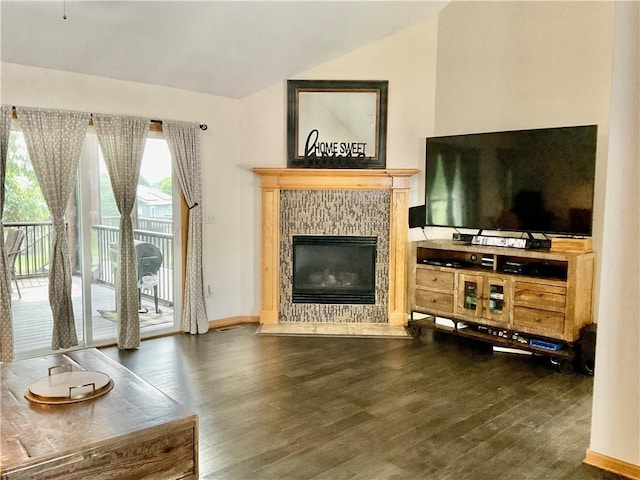 11601 N Manning Ave, Kansas City, MO 64157 - living area featuring lofted ceiling, wood finished floors, a tile fireplace, and baseboards