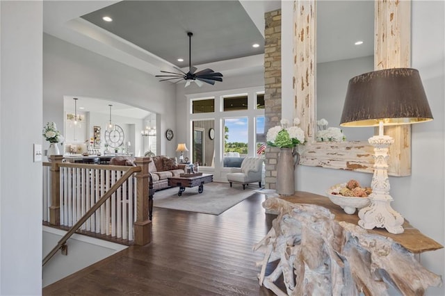 4313 Lakeview Ter, Basehor, KS 66007 - living area with wood finished floors, recessed lighting, a ceiling fan, arched walkways, and a chandelier