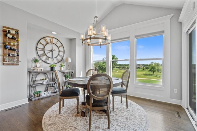 4313 Lakeview Ter, Basehor, KS 66007 - dining area with a chandelier, vaulted ceiling, dark wood-type flooring, view of golf course, and baseboards