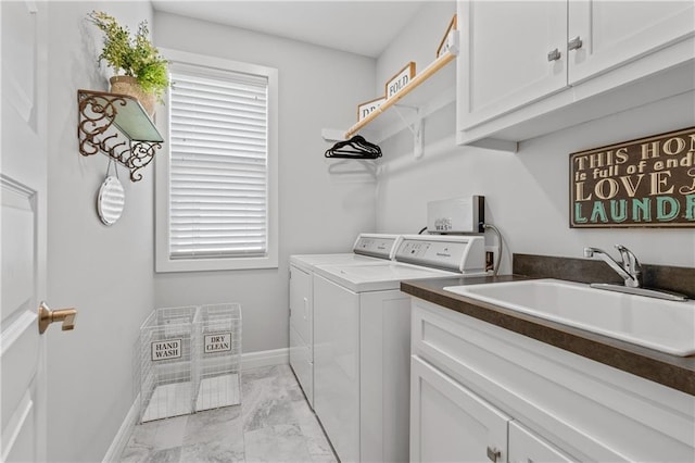 4313 Lakeview Ter, Basehor, KS 66007 - laundry room with independent washer and dryer, light marble finish floors, cabinet space, and baseboards