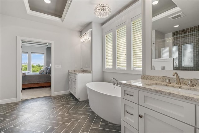 4313 Lakeview Ter, Basehor, KS 66007 - ensuite bathroom with a raised ceiling, two vanities, baseboards, a shower stall, and recessed lighting