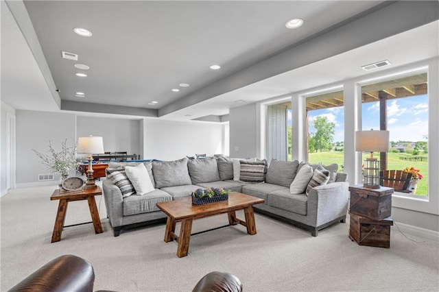 4313 Lakeview Ter, Basehor, KS 66007 - living room with light carpet, baseboards, and recessed lighting