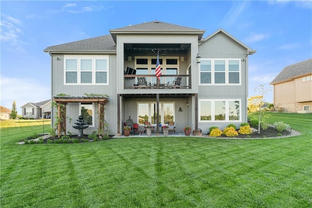 4313 Lakeview Ter, Basehor, KS 66007 - back of property with a balcony, a lawn, a patio, ceiling fan, and a shingled roof