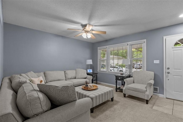 105 SW Alderson Pl, Lees Summit, MO 64063 - living room with a ceiling fan, baseboards, light colored carpet, and a textured ceiling