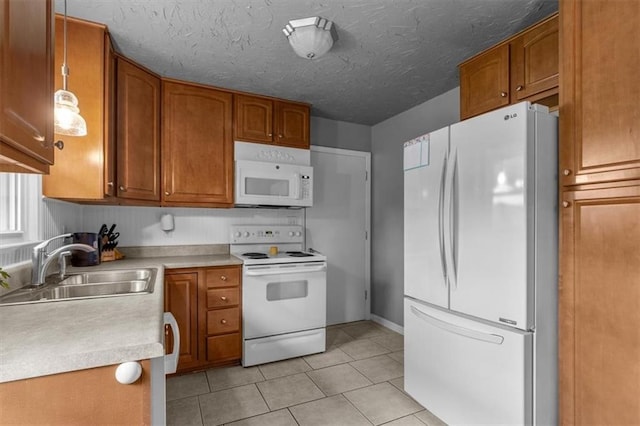 105 SW Alderson Pl, Lees Summit, MO 64063 - kitchen with white appliances, a sink, brown cabinetry, and light countertops