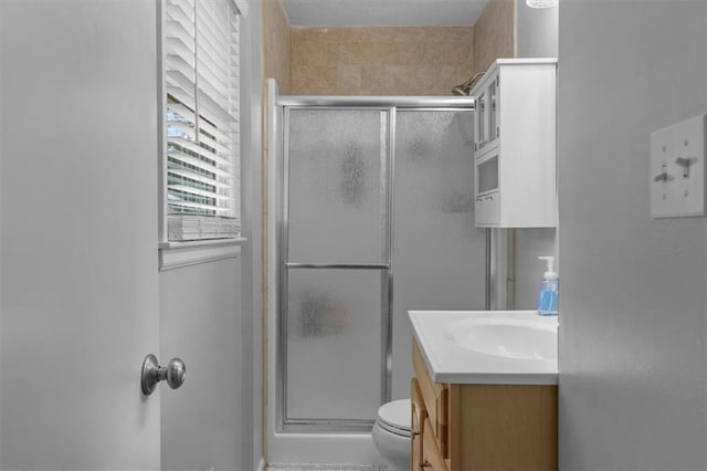 105 SW Alderson Pl, Lees Summit, MO 64063 - full bathroom featuring vanity, a stall shower, and toilet