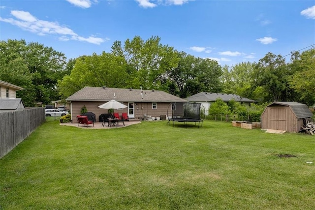 105 SW Alderson Pl, Lees Summit, MO 64063 - rear view of property with a trampoline, a patio, and view of scattered trees