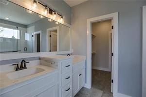 16247 S Kill Creek Rd, Gardner, KS 66030 - full bathroom featuring double vanity, an enclosed shower, and a spacious closet