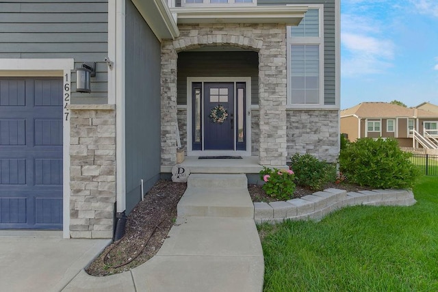 16247 S Kill Creek Rd, Gardner, KS 66030 - property entrance with stone siding and a garage