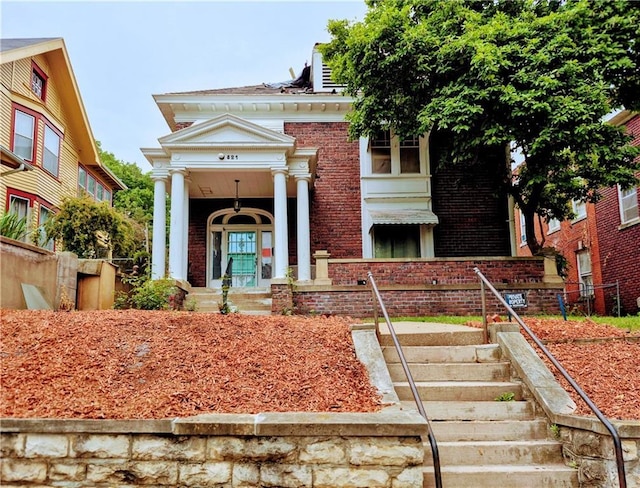 821 N 24th St, Saint Joseph, MO 64506 - view of front of property with brick siding and a porch