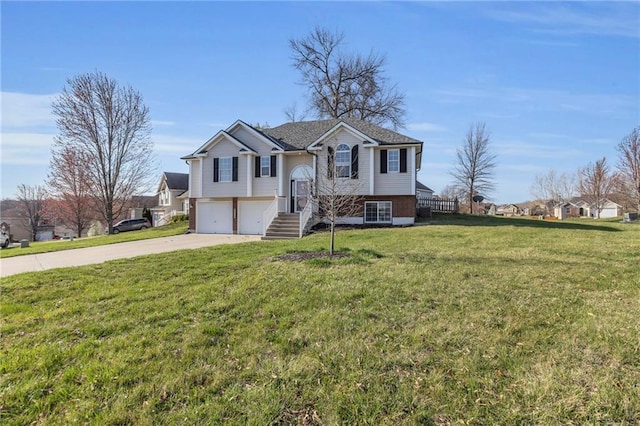 3708 N 112th St, Kansas City, KS 66109 - split foyer home featuring an attached garage, concrete driveway, and a front lawn