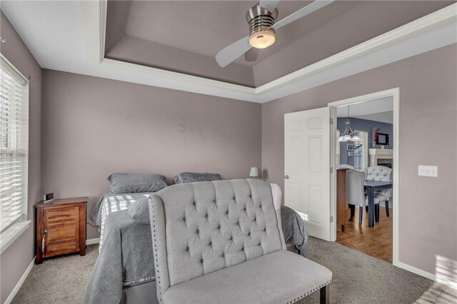 3708 N 112th St, Kansas City, KS 66109 - carpeted bedroom with baseboards, a raised ceiling, and ceiling fan