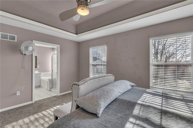 3708 N 112th St, Kansas City, KS 66109 - carpeted bedroom with baseboards, ensuite bath, a raised ceiling, and a ceiling fan