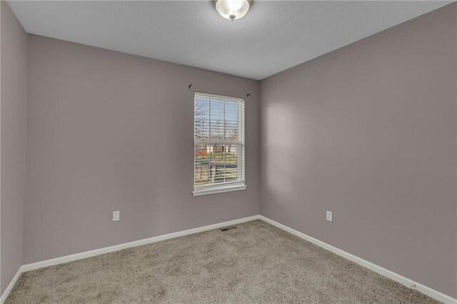3708 N 112th St, Kansas City, KS 66109 - carpeted empty room with baseboards