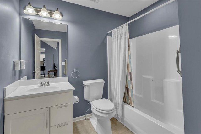 3708 N 112th St, Kansas City, KS 66109 - full bathroom featuring vanity, toilet, shower / tub combo, tile patterned flooring, and baseboards