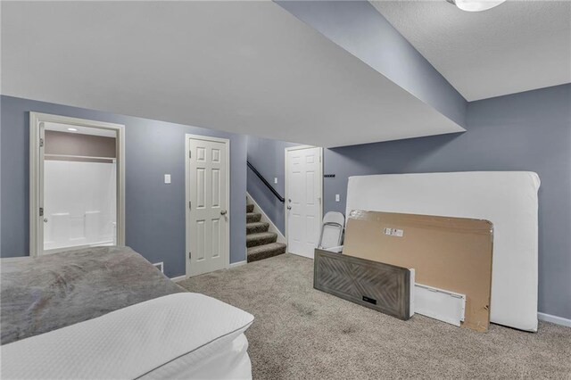3708 N 112th St, Kansas City, KS 66109 - carpeted living room featuring stairway and baseboards