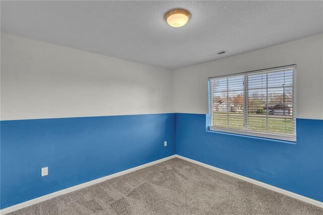 3708 N 112th St, Kansas City, KS 66109 - spare room featuring carpet flooring and baseboards