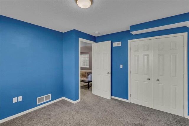 3708 N 112th St, Kansas City, KS 66109 - unfurnished bedroom featuring carpet flooring, baseboards, and a closet