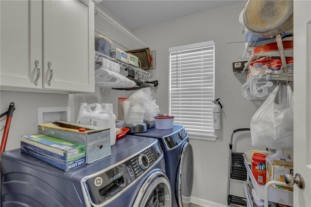 3708 N 112th St, Kansas City, KS 66109 - washroom with washer and clothes dryer, cabinet space, and baseboards
