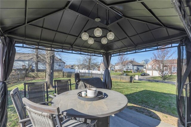 3708 N 112th St, Kansas City, KS 66109 - sunroom with lofted ceiling, outdoor dining space, and a residential view