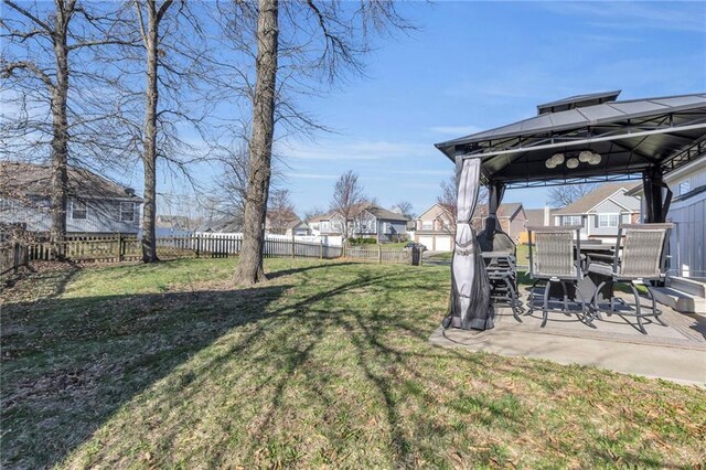3708 N 112th St, Kansas City, KS 66109 - view of yard featuring a gazebo, a patio area, outdoor dining space, and a residential view