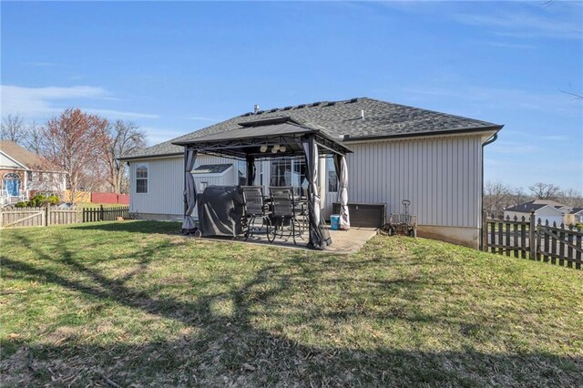 3708 N 112th St, Kansas City, KS 66109 - rear view of property featuring a gazebo, a patio, and roof with shingles