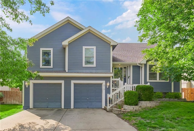 616 N Winwood Ter, Gardner, KS 66030 - split level home featuring driveway, an attached garage, and a shingled roof