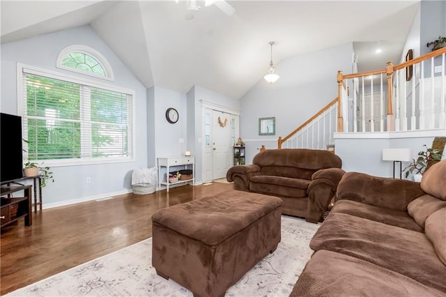 616 N Winwood Ter, Gardner, KS 66030 - living room with lofted ceiling, wood finished floors, stairway, a ceiling fan, and baseboards