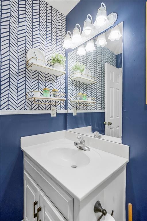 616 N Winwood Ter, Gardner, KS 66030 - bathroom featuring wallpapered walls and vanity