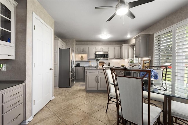7918 W 118th Pl, Overland Park, KS 66210 - dining room with healthy amount of natural light, light tile patterned flooring, and ceiling fan