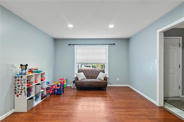 10538 Cleveland Ave, Kansas City, MO 64137 - game room with wood finished floors and recessed lighting