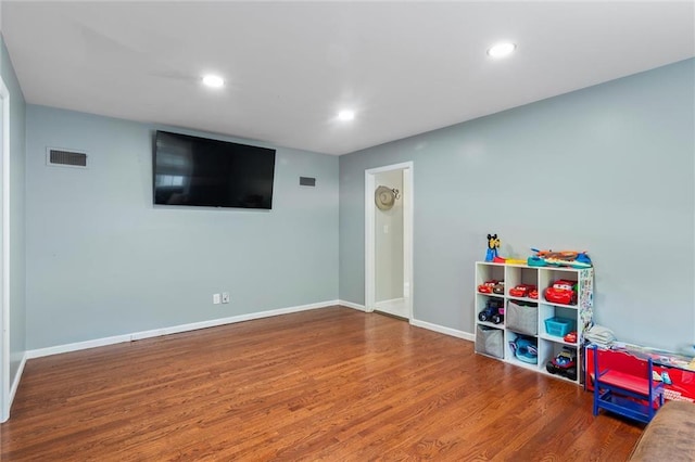 10538 Cleveland Ave, Kansas City, MO 64137 - game room featuring wood finished floors and recessed lighting