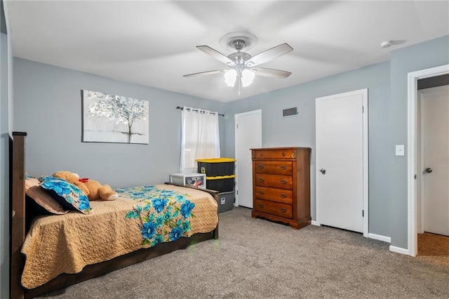 10538 Cleveland Ave, Kansas City, MO 64137 - carpeted bedroom with baseboards and a ceiling fan