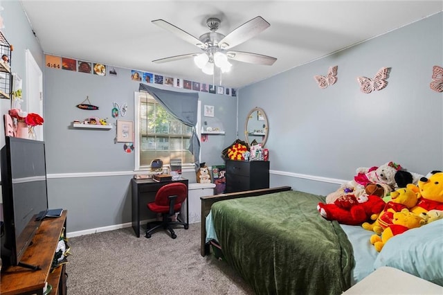 10538 Cleveland Ave, Kansas City, MO 64137 - carpeted bedroom with an office area and a ceiling fan