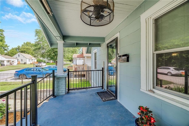 1025 S Park Ave, Independence, MO 64050 - porch with ceiling fan and a residential view