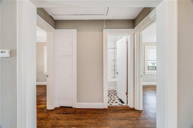 1025 S Park Ave, Independence, MO 64050 - hall featuring dark wood-style floors and attic access