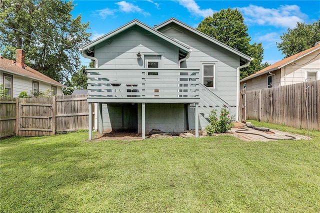 1025 S Park Ave, Independence, MO 64050 - rear view of house with a wooden deck, a fenced backyard, and stairway