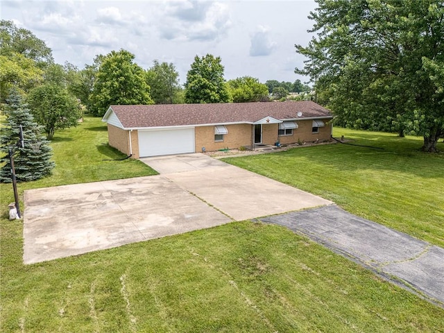 32581 Lookout Rd, Paola, KS 66071 - single story home featuring brick siding, concrete driveway, a front lawn, and a garage
